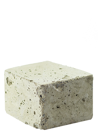 Cream coloured concrete block against a white background
